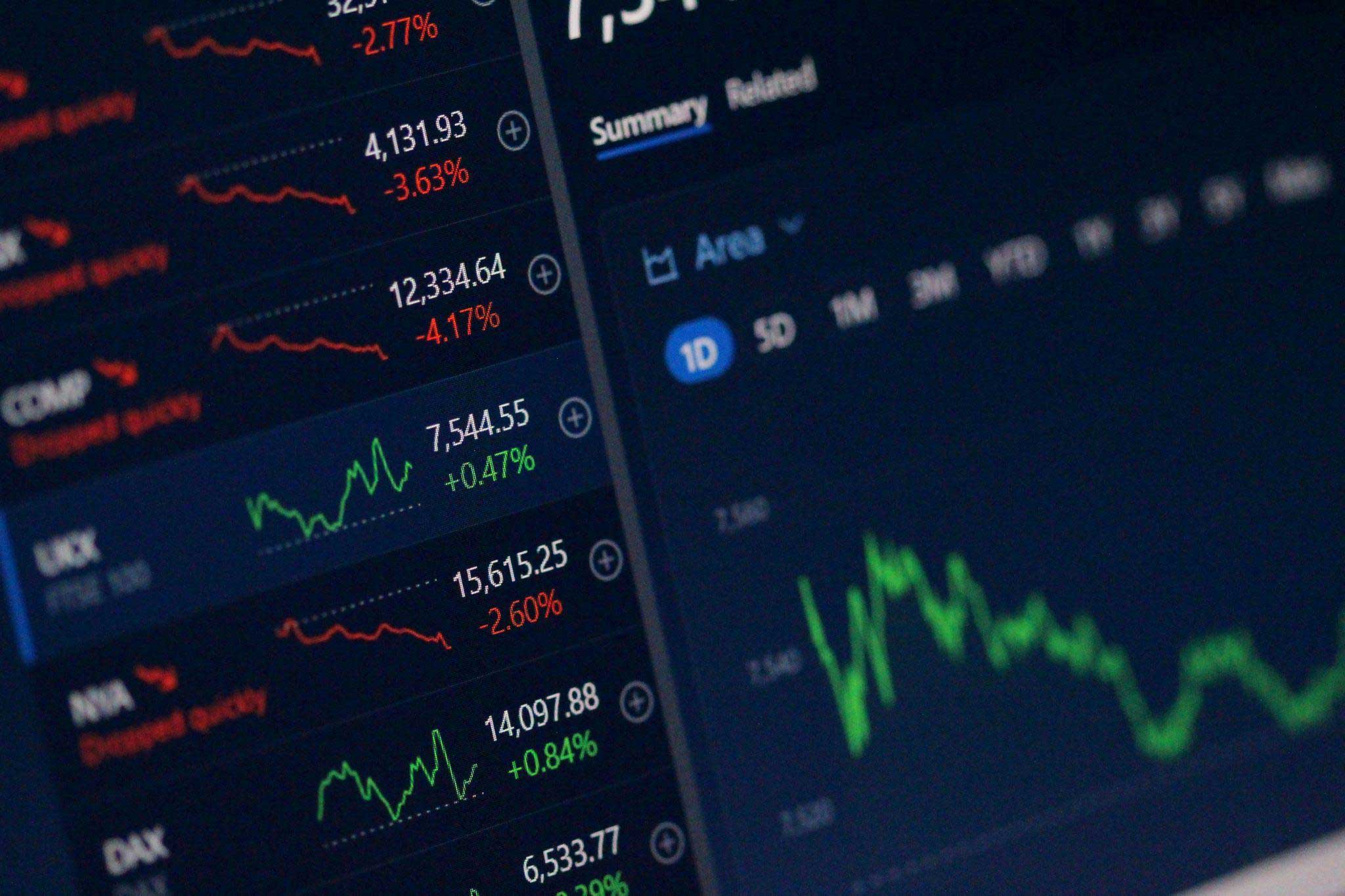 A picture of a computer screen with a list of crypto prices and charts.